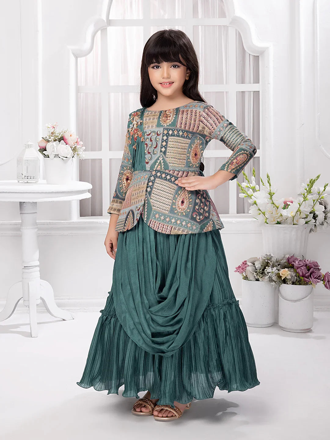 Betty Girls’ Green Ethnic Printed Flared Gown with Drape – Festive Wear.