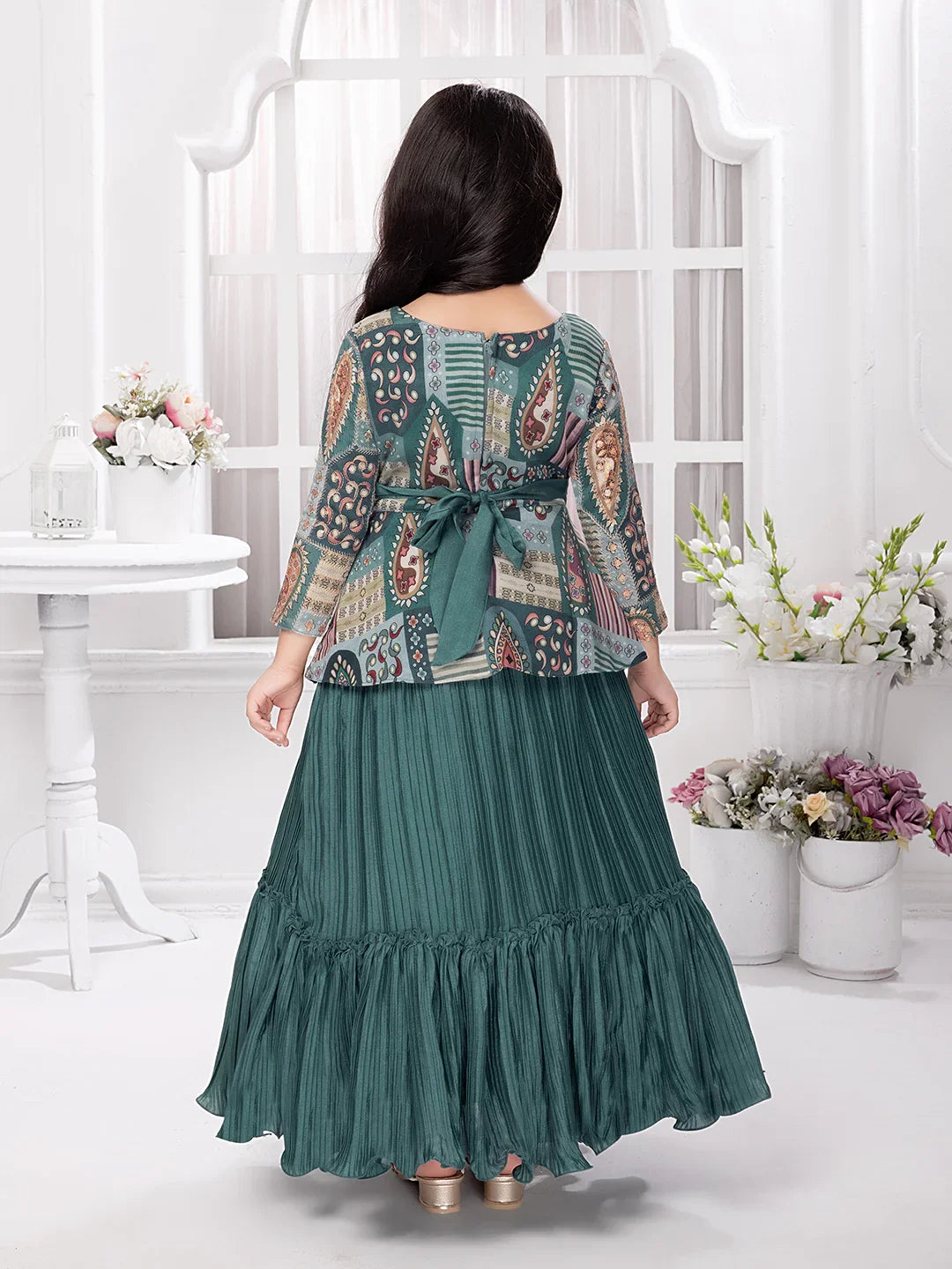 Betty Girls’ Green Ethnic Printed Flared Gown with Drape – Festive Wear.